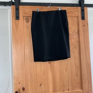 Black knee length w/ pleat in back- new!